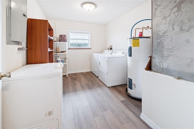 78 SE 901st Ave, Suwannee, FL 32692 - washroom with water heater, washer and dryer, electric panel, and wood finished floors