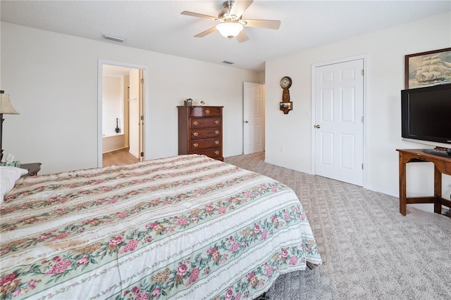 78 SE 901st Ave, Suwannee, FL 32692 - carpeted bedroom with ensuite bathroom and a ceiling fan