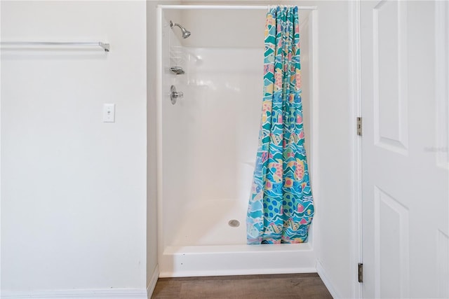 78 SE 901st Ave, Suwannee, FL 32692 - bathroom with curtained shower and wood finished floors