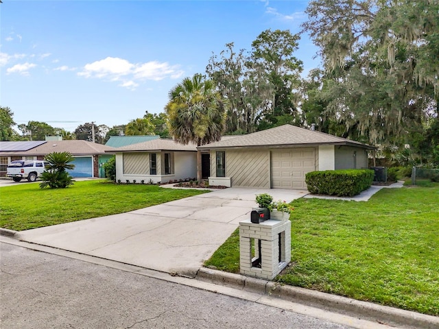 2330 NW 54th Ter, Gainesville, FL 32606 - ranch-style home with driveway, a front lawn, a garage, and stucco siding