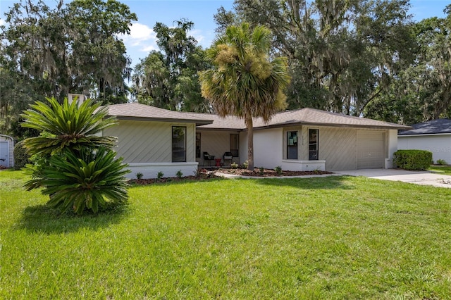 2330 NW 54th Ter, Gainesville, FL 32606 - ranch-style house with a garage, concrete driveway, and a front yard