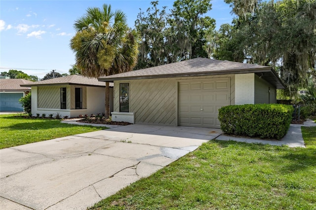 2330 NW 54th Ter, Gainesville, FL 32606 - ranch-style home with a front yard, concrete driveway, brick siding, an attached garage, and roof with shingles