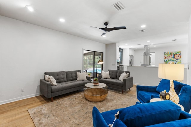 2330 NW 54th Ter, Gainesville, FL 32606 - living area featuring light wood-style flooring, a ceiling fan, and recessed lighting