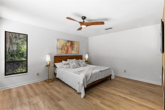 2330 NW 54th Ter, Gainesville, FL 32606 - bedroom with light wood-style floors and ceiling fan