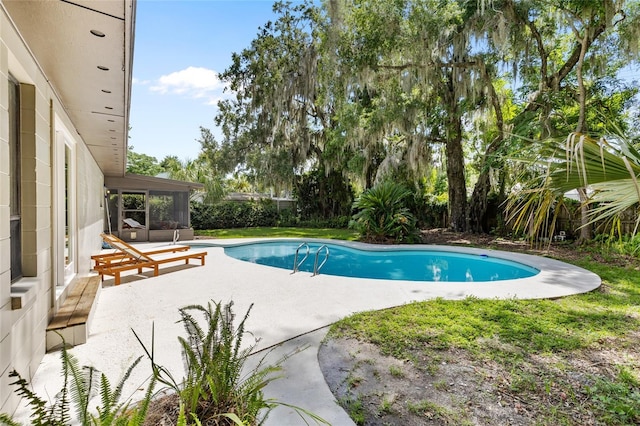 2330 NW 54th Ter, Gainesville, FL 32606 - outdoor pool featuring a patio, a sunroom, and a fenced backyard