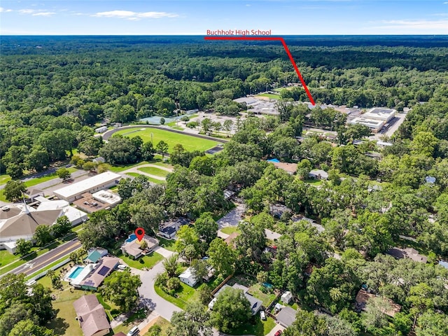 2330 NW 54th Ter, Gainesville, FL 32606 - aerial view of property and surrounding area featuring a heavily wooded area and nearby suburban area
