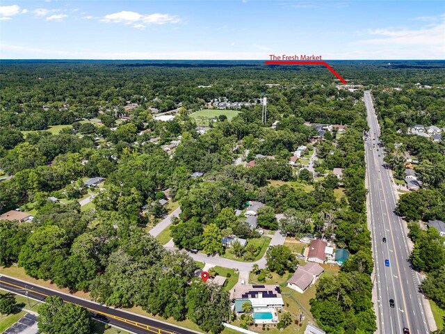 2330 NW 54th Ter, Gainesville, FL 32606 - drone / aerial view of a major roadway and a heavily wooded area