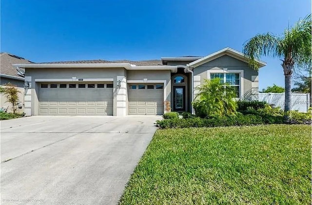 2048 Bristol Grande Way, Orlando, FL 32820 - view of front of property with a garage, concrete driveway, stucco siding, and a front lawn
