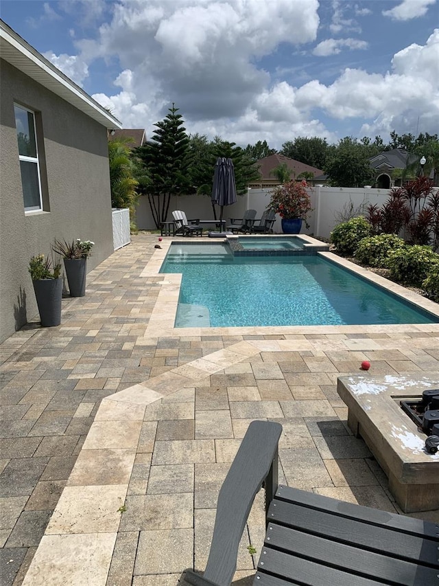 2048 Bristol Grande Way, Orlando, FL 32820 - view of pool featuring a patio area, a fenced backyard, and a pool with connected hot tub