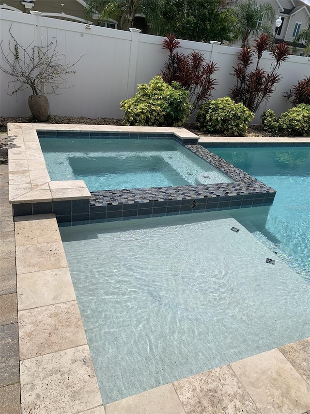 2048 Bristol Grande Way, Orlando, FL 32820 - view of swimming pool with a fenced backyard and a pool with connected hot tub