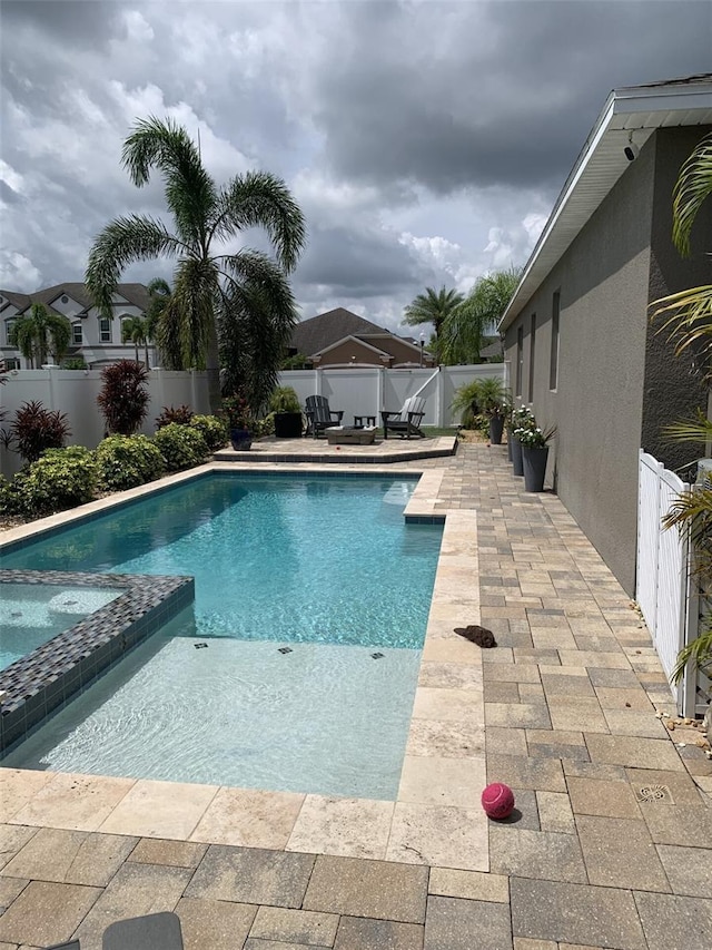 2048 Bristol Grande Way, Orlando, FL 32820 - view of swimming pool featuring a fenced backyard, a patio area, and a pool with connected hot tub