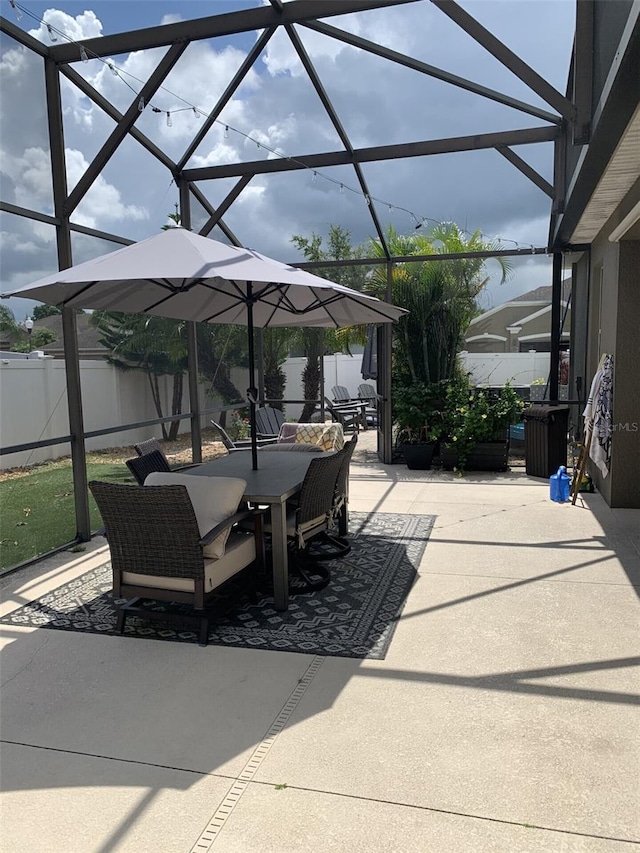 2048 Bristol Grande Way, Orlando, FL 32820 - fenced backyard with a patio area, outdoor dining area, and glass enclosure