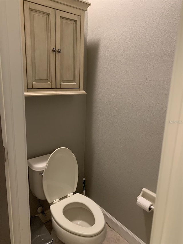 2048 Bristol Grande Way, Orlando, FL 32820 - bathroom with toilet and baseboards