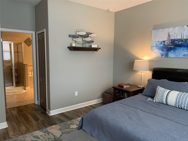 2048 Bristol Grande Way, Orlando, FL 32820 - bedroom featuring wood finished floors and connected bathroom