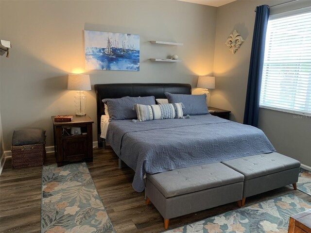 2048 Bristol Grande Way, Orlando, FL 32820 - bedroom featuring wood finished floors and multiple windows