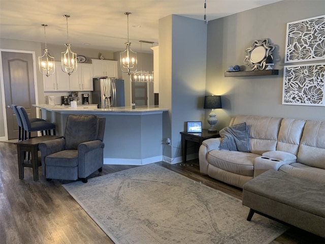2048 Bristol Grande Way, Orlando, FL 32820 - living room featuring a chandelier and dark wood-type flooring