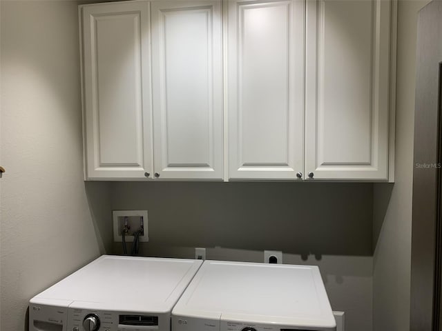 2048 Bristol Grande Way, Orlando, FL 32820 - laundry room with cabinet space and independent washer and dryer