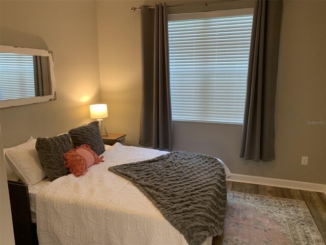 2048 Bristol Grande Way, Orlando, FL 32820 - bedroom featuring wood finished floors and baseboards