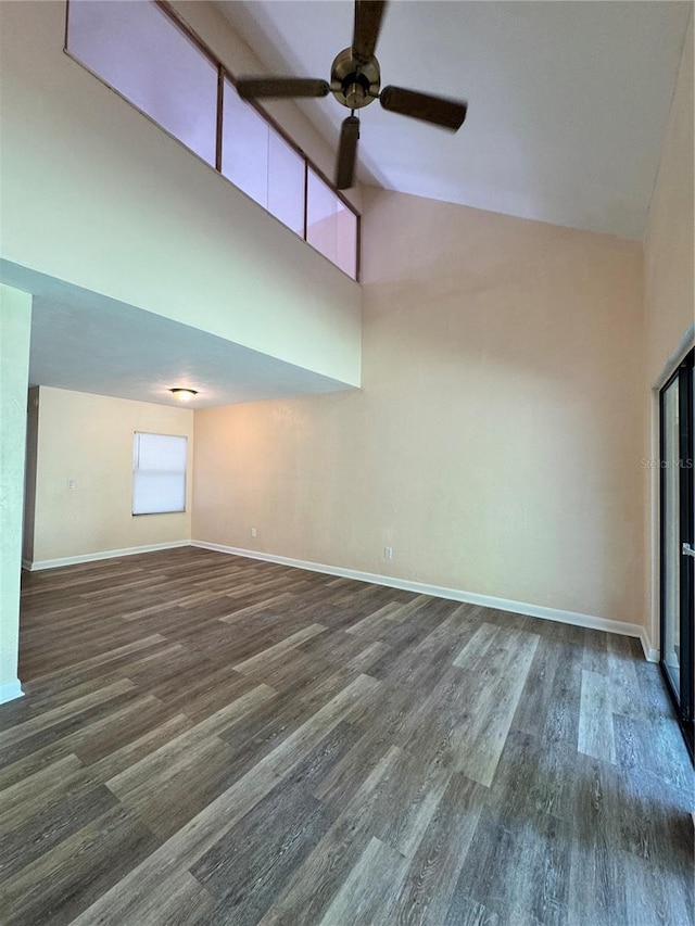 4224 SW 70th Ter Unit A, Gainesville, FL 32608 - empty room with dark wood-style floors, ceiling fan, and high vaulted ceiling