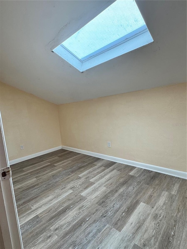 4224 SW 70th Ter Unit A, Gainesville, FL 32608 - bonus room with a skylight, wood finished floors, and vaulted ceiling