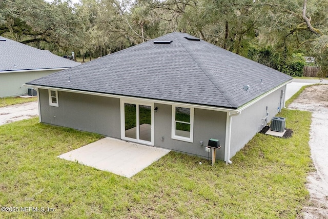 1262 Coral Farms Rd, Florahome, FL 32140 - back of property with a shingled roof, a yard, stucco siding, and a patio area