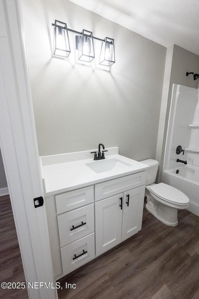 1262 Coral Farms Rd, Florahome, FL 32140 - full bath with vanity, wood finished floors, and shower / bath combination