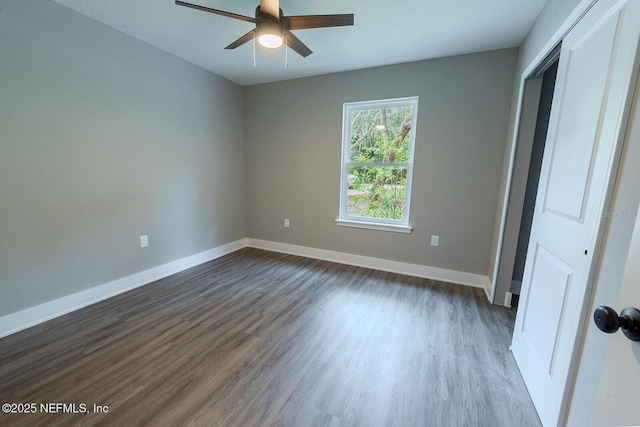 1262 Coral Farms Rd, Florahome, FL 32140 - unfurnished bedroom with dark wood-style floors, a closet, and ceiling fan