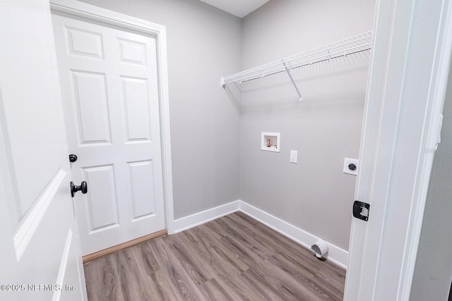 1262 Coral Farms Rd, Florahome, FL 32140 - laundry area featuring hookup for a washing machine, wood finished floors, and electric dryer hookup