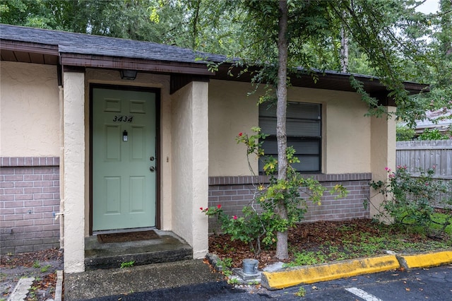 3434 NW 21st Dr Unit D4, Gainesville, FL 32605 - entrance to property with stucco siding and a shingled roof