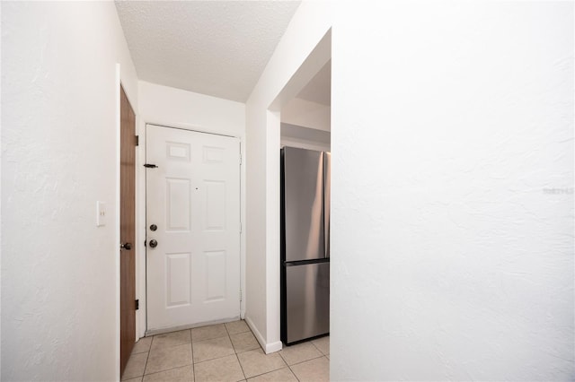 3434 NW 21st Dr Unit D4, Gainesville, FL 32605 - hall featuring light tile patterned floors and a textured ceiling