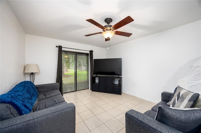 3434 NW 21st Dr Unit D4, Gainesville, FL 32605 - living area featuring light tile patterned floors, ceiling fan, and a textured ceiling
