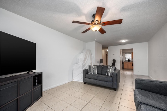 3434 NW 21st Dr Unit D4, Gainesville, FL 32605 - living area featuring a ceiling fan, light tile patterned floors, and a textured ceiling