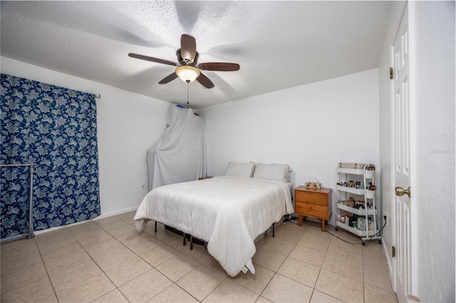 3434 NW 21st Dr Unit D4, Gainesville, FL 32605 - bedroom featuring light tile patterned floors, a textured ceiling, and a ceiling fan