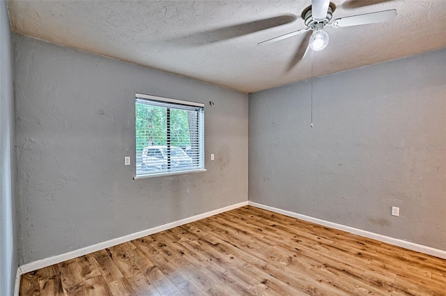 89 SE 16th Ave Unit P102, Gainesville, FL 32601 - unfurnished room featuring wood finished floors, ceiling fan, and a textured ceiling