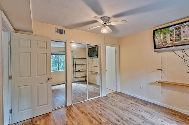 89 SE 16th Ave Unit P102, Gainesville, FL 32601 - unfurnished bedroom featuring light wood-style floors and ceiling fan