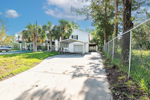 145 SE 904th Ave, Suwannee, FL 32692 - view of front of house with a garage, a carport, and driveway