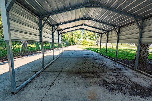 145 SE 904th Ave, Suwannee, FL 32692 - view of parking / parking lot with a carport