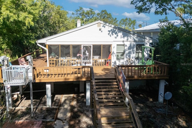 145 SE 904th Ave, Suwannee, FL 32692 - back of house with a wooden deck and a sunroom