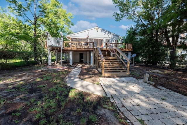 145 SE 904th Ave, Suwannee, FL 32692 - rear view of property with stairs and a wooden deck