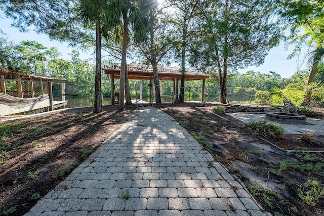 145 SE 904th Ave, Suwannee, FL 32692 - view of property's community featuring a gazebo, an outdoor fire pit, and a patio area