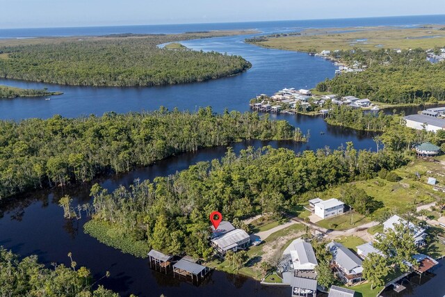 145 SE 904th Ave, Suwannee, FL 32692 - aerial view of property and surrounding area featuring a large body of water and a heavily wooded area