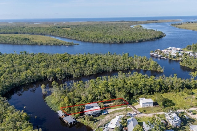 145 SE 904th Ave, Suwannee, FL 32692 - aerial view of property and surrounding area featuring a large body of water and property boundaries highlighted