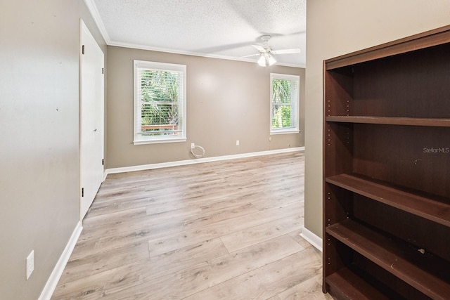 145 SE 904th Ave, Suwannee, FL 32692 - empty room featuring ornamental molding, wood finished floors, a textured ceiling, plenty of natural light, and ceiling fan