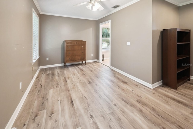 145 SE 904th Ave, Suwannee, FL 32692 - spare room with crown molding, a ceiling fan, and light wood-style flooring