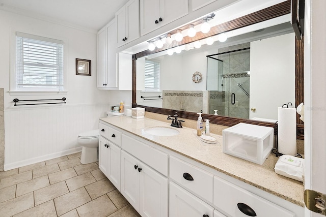 145 SE 904th Ave, Suwannee, FL 32692 - full bath with vanity, a shower stall, wainscoting, tile patterned flooring, and crown molding