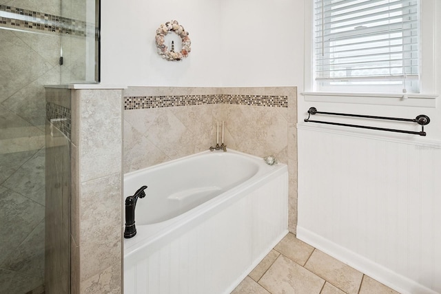 145 SE 904th Ave, Suwannee, FL 32692 - full bath featuring a bath, a stall shower, wainscoting, and tile patterned flooring
