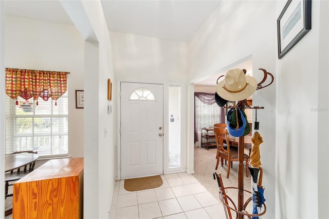 1602 NW 117th Ter, Gainesville, FL 32606 - entryway featuring light tile patterned floors and a towering ceiling