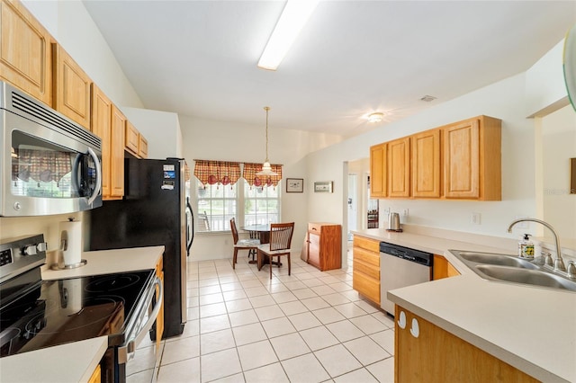1602 NW 117th Ter, Gainesville, FL 32606 - kitchen featuring appliances with stainless steel finishes, light tile patterned floors, light countertops, pendant lighting, and light brown cabinets
