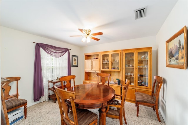 1602 NW 117th Ter, Gainesville, FL 32606 - dining room with a ceiling fan and light carpet