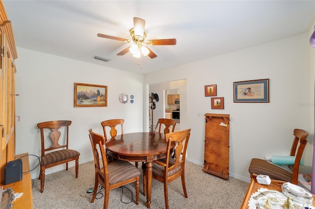 1602 NW 117th Ter, Gainesville, FL 32606 - dining area with a ceiling fan and light colored carpet